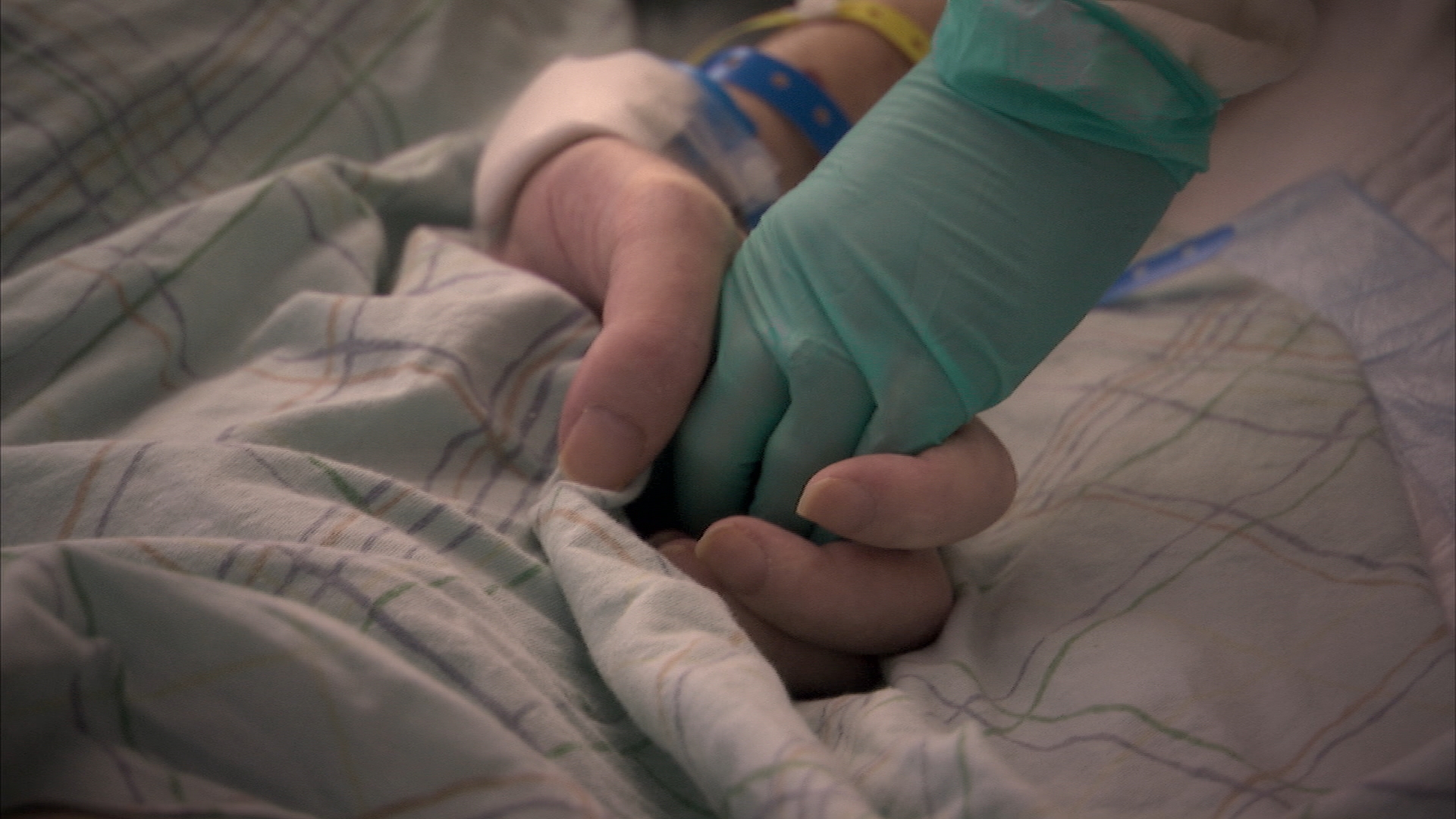 Facing Death: Nurse squeezing hand