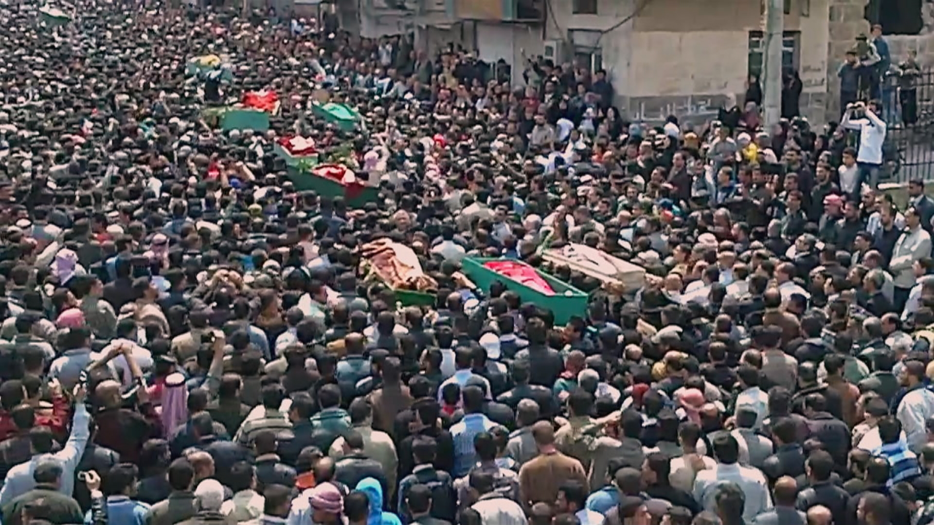 coffins in crowd