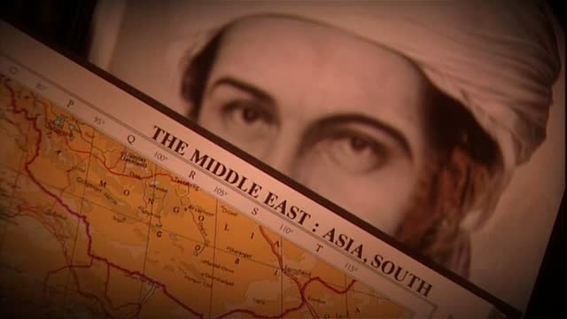 bin Laden peeks over your book and frightens you