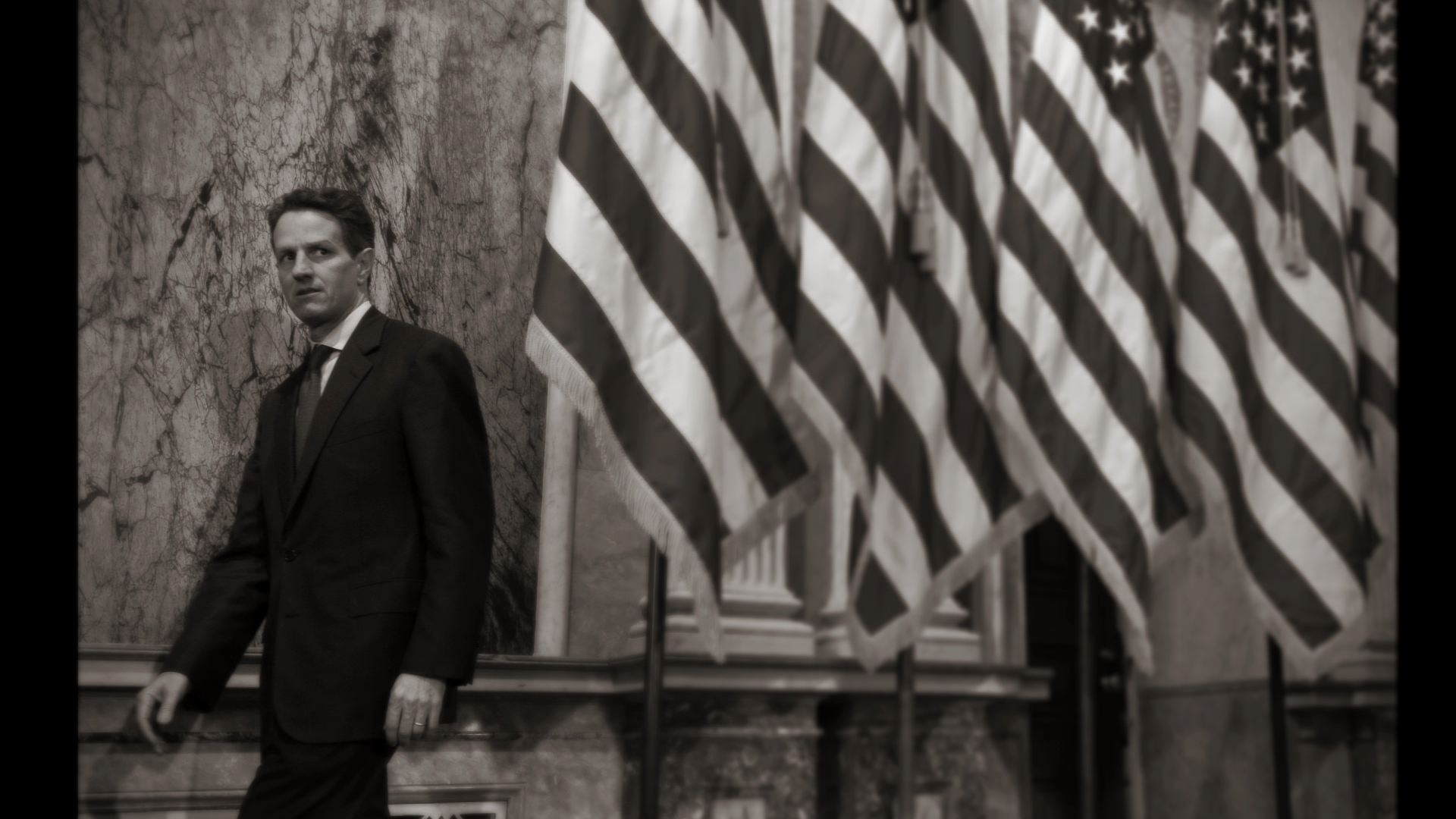 geithner and flags