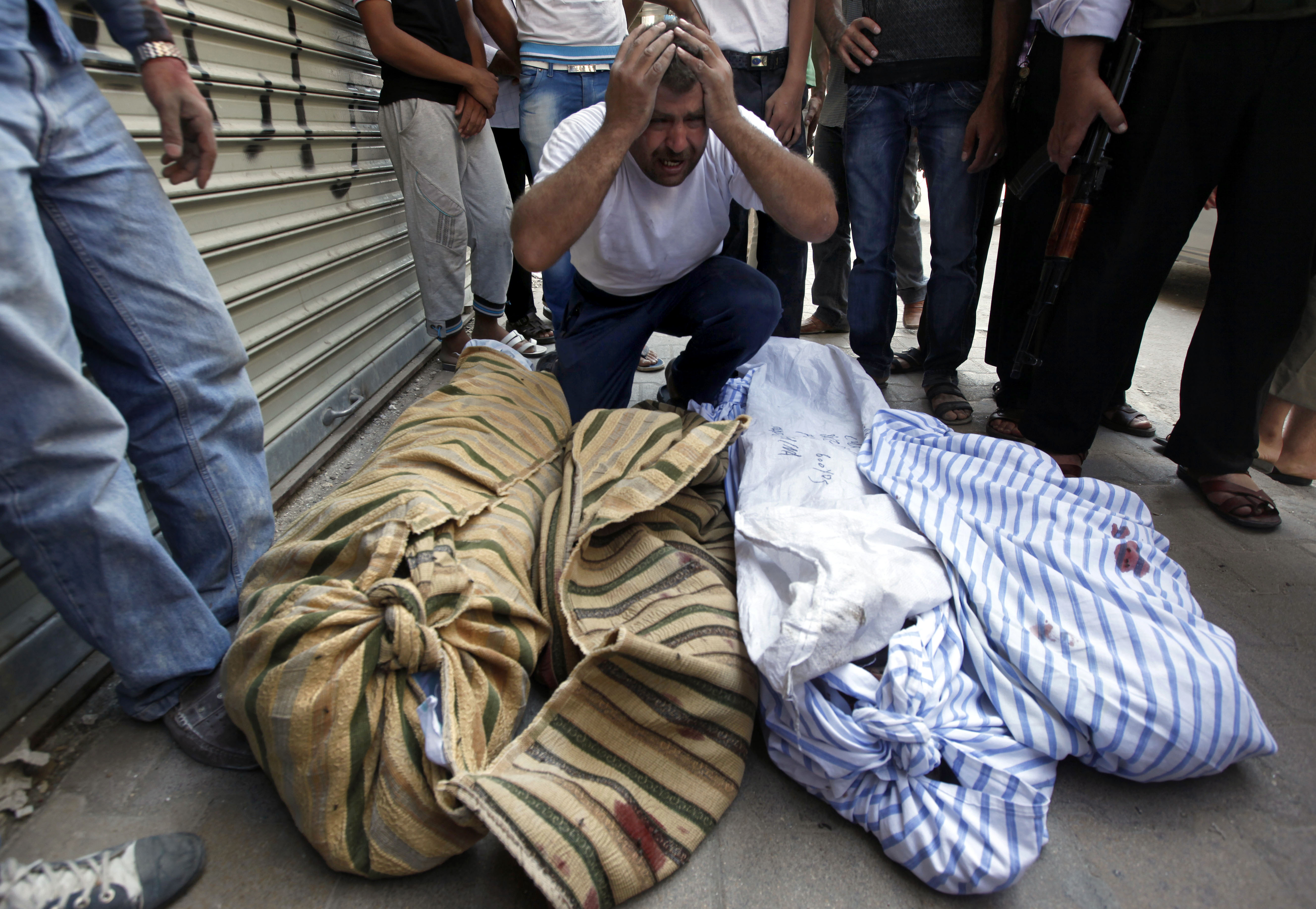 Syrian Man Grives Four Family Members Killed in Aleppo Air Strike