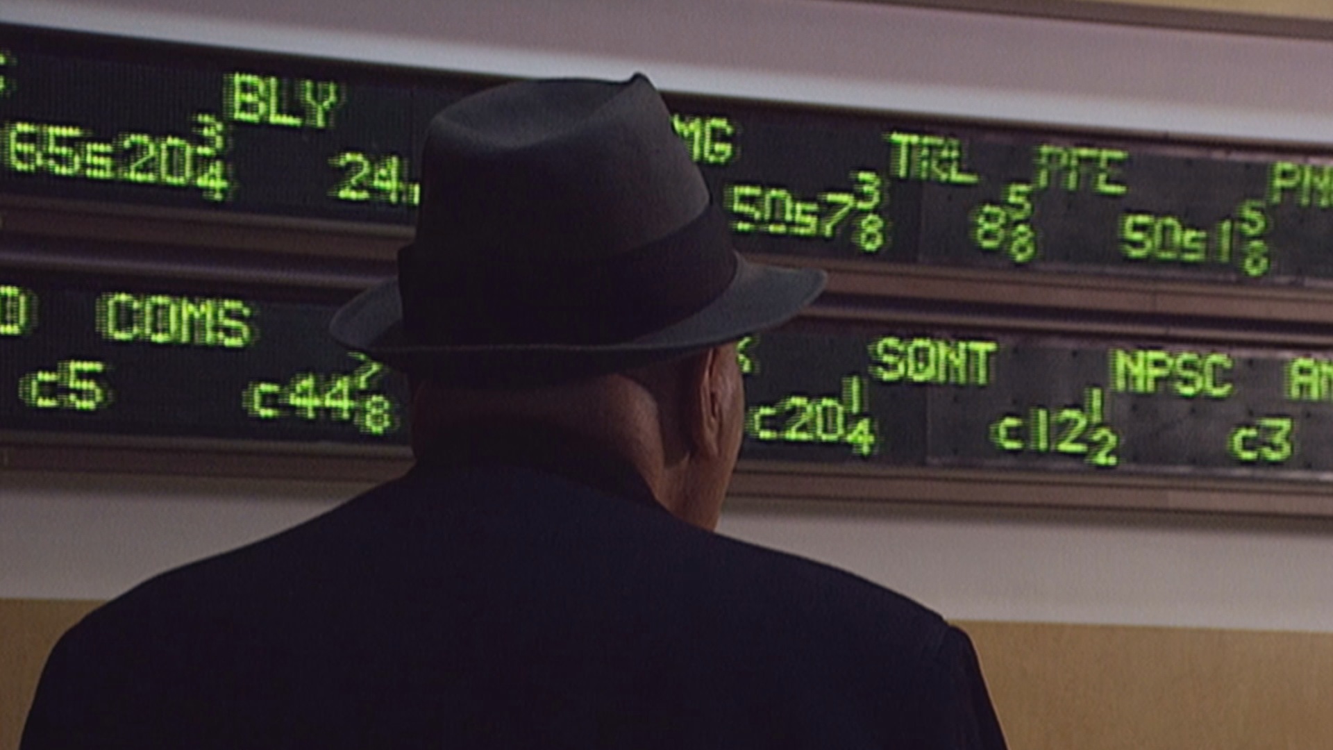 old guy looking at ticker