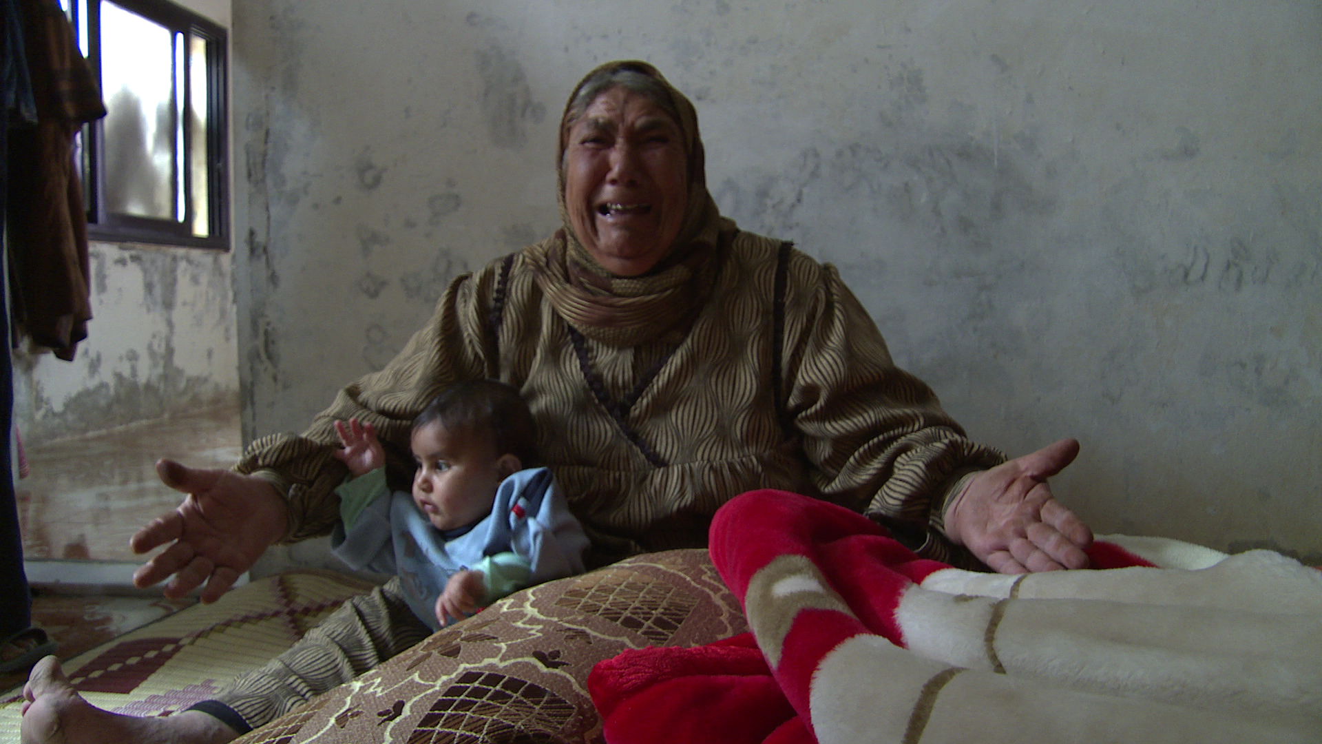 woman with baby crying