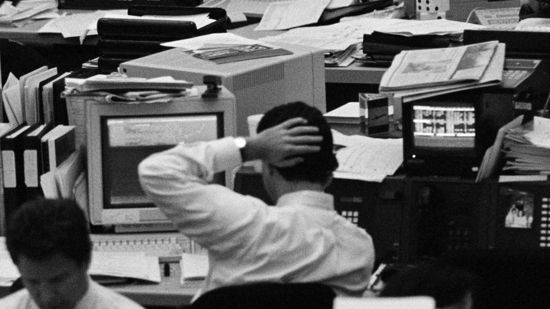 trader holds head