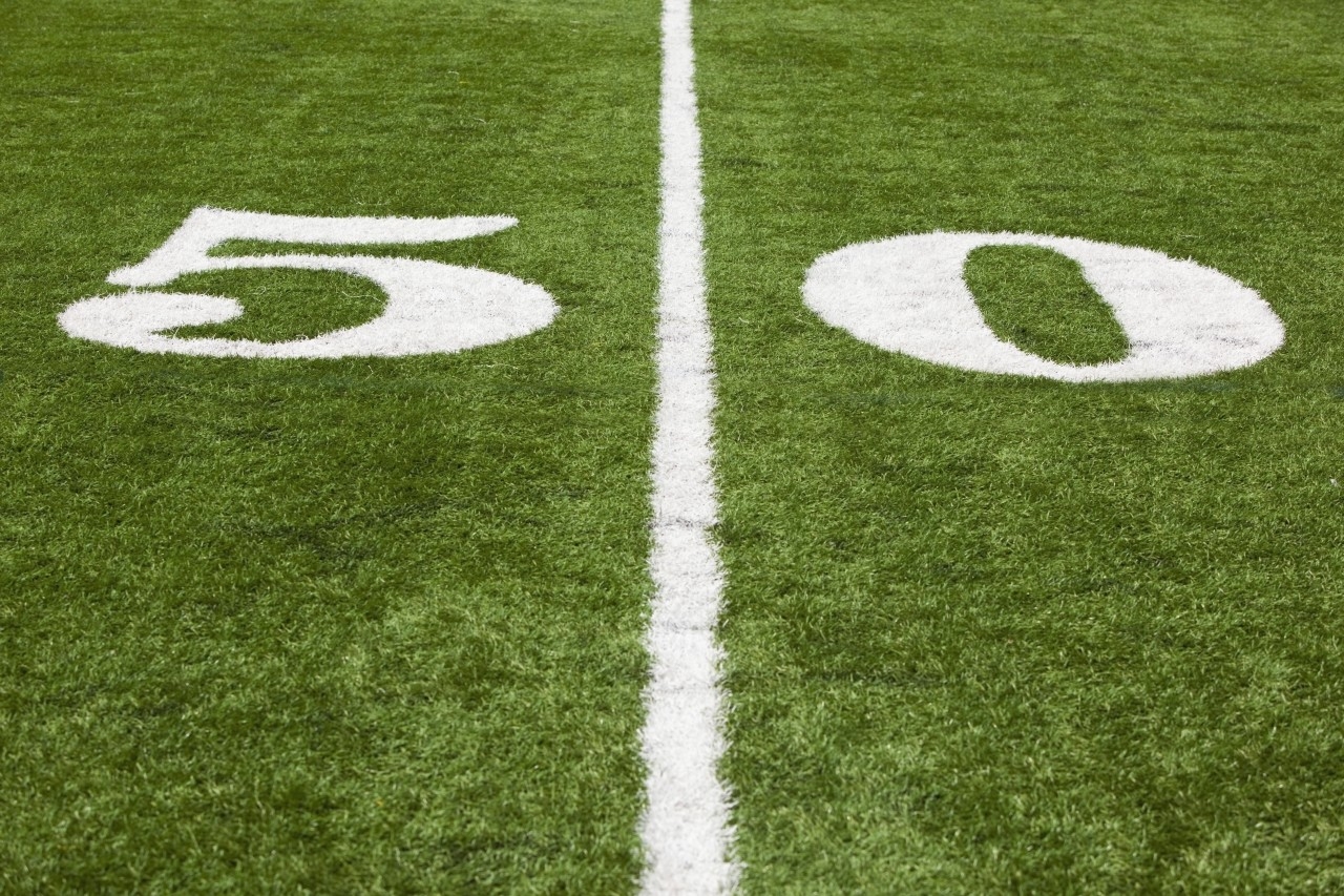 Football High: The 50 Yard Line Marked On A Football Field