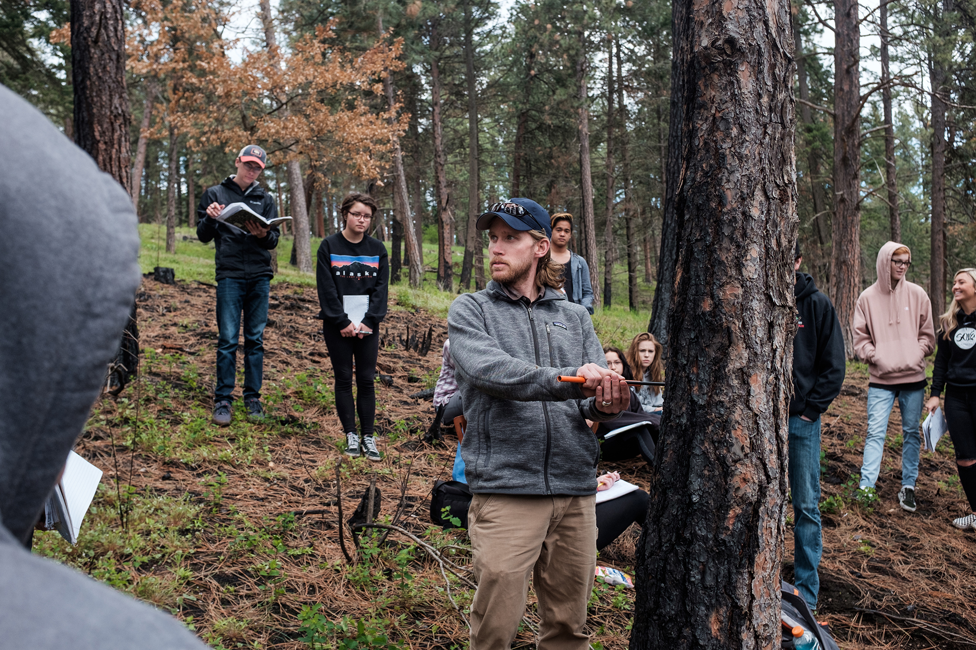 Idaho high school teacher introduces the concept of climate change by taking his students to the forest.