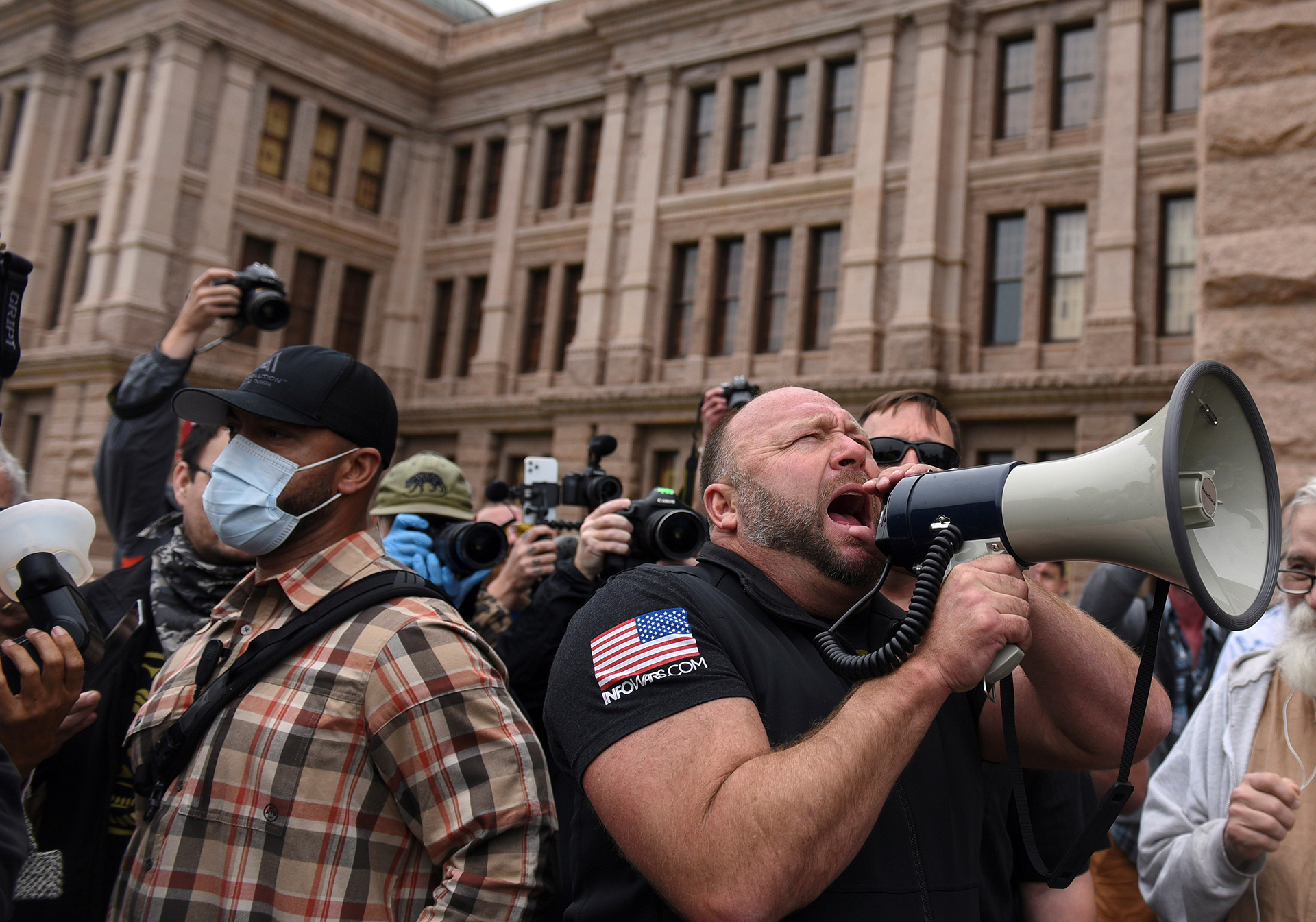 Protesters against the state's extended stay-at-home order demonstrate in Austin